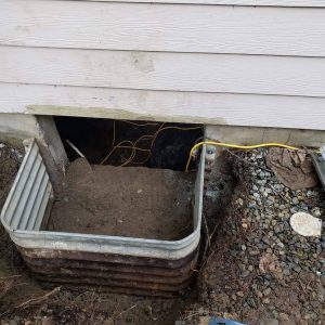 After progress of digging and remounting crawlspace well to foundation of home by Sasquatch pest control