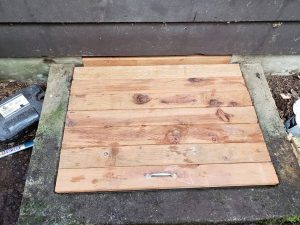Progress photo of crawlspace door cover built by Sasquatch pest control